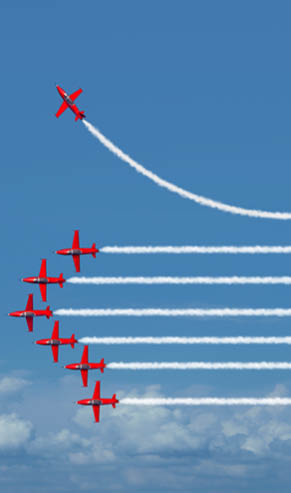 A jet is leaving a trail of smoke behind it. Description generated by AI