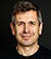 A man wearing a black shirt. Description generated by AI