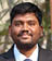 A man wearing a suit and tie. Description generated by AI