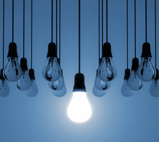 A row of light bulbs hanging from the ceiling. Description generated by AI